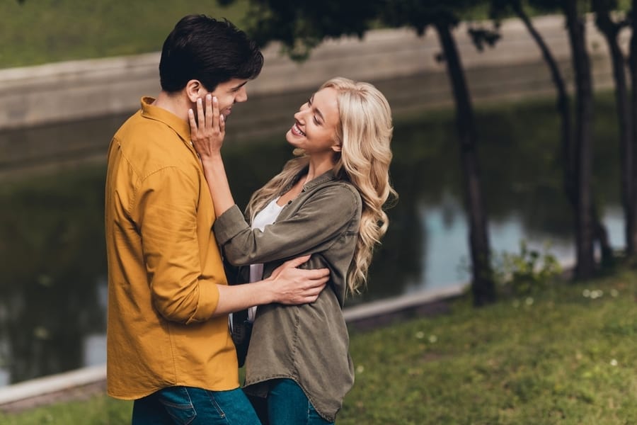 A Portrait Taken From The Side Of A Tender And Affectionate Couple Who Are Life Partners, Enjoying Their Weekend By Cuddling Outdoors And Traveling In The Fresh Air.